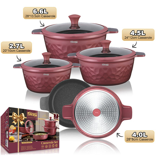 Set of red casseroles with different capacities and a box in the background.
