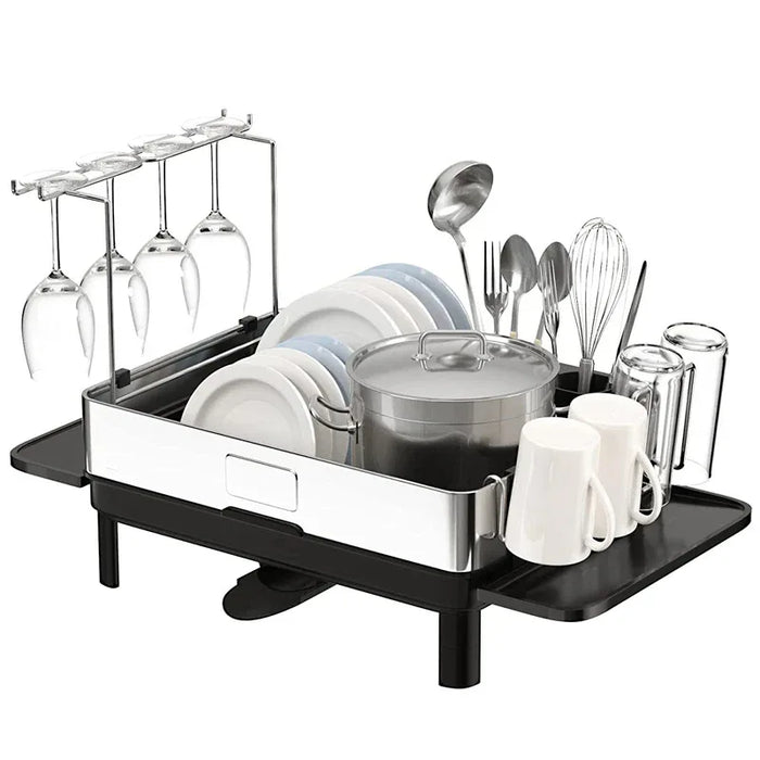 Dish drying rack with glasses, plates, utensils, and mugs on a white background